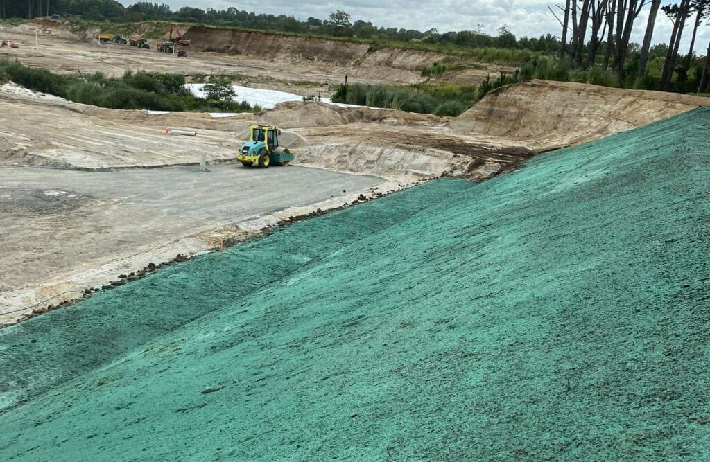 Hydro mulching on a steep embankment for erosion control.